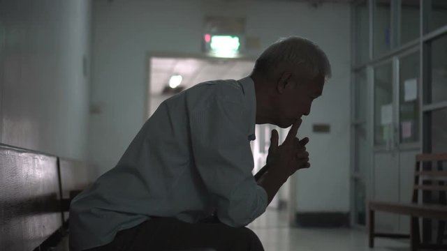Asian senior elderly man worry about health medication fee at hospital