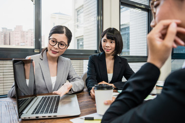 female manager using laptop to show new project