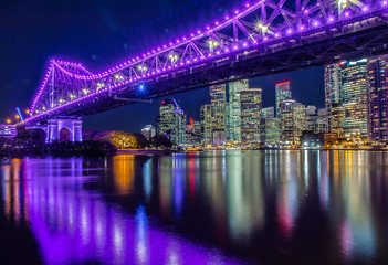 Illuminated bridge above river in night - obrazy, fototapety, plakaty