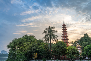 Tran Quoc pagoda during sunset time, the oldest temple in Hanoi, Vietnam. Hanoi cityscape.