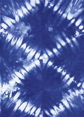 Abstract tie dyed fabric of indigo color on white cotton. Hand painted fabrics. Shibori dyeing