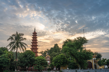 Tran Quoc pagoda during sunset time, the oldest temple in Hanoi, Vietnam. Hanoi cityscape.