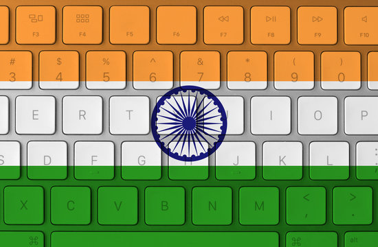 Indian flag and computer keyboard in the background. India flag