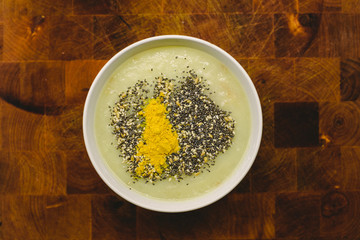 Healthy detox dish of  vegetarian soup with seeds and turmeric