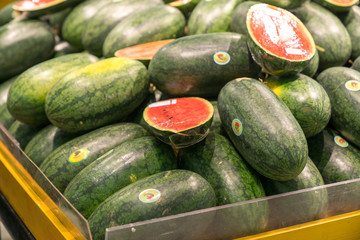 Fresh healthy fruits on shelves in supermarket