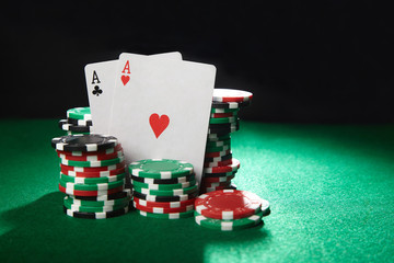A pair of aces and stack of chips. Casino game concept.