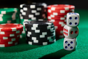 Chips and dices on casino table. Gambling concept.