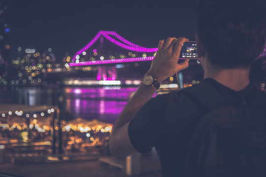 Man taking picture of beautiful cityscape