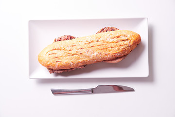 Tasty sandwich made of crispy baguette and chicken