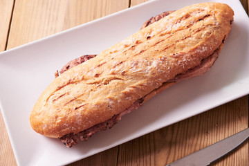 Tasty sandwich made of crispy baguette and chicken