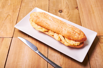 Tasty sandwich made of crispy baguette and omelette