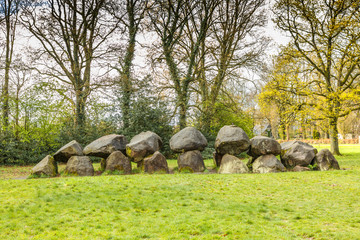 Dolmen D18  near the city of Rolde in the Dutch province of Drenthe with a background of oak trees....