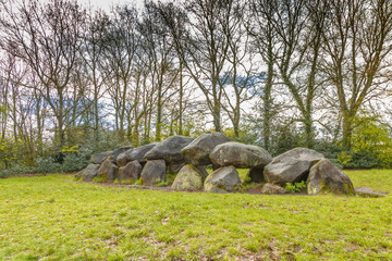 Dolmen D18  near the city of Rolde in the Dutch province of Drenthe with a background of oak trees....