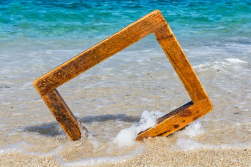 Fototapeta premium wooden picture frame at sea