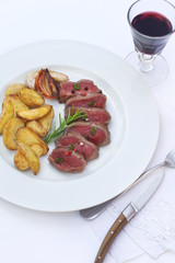 Roast beef and French fries on a plate