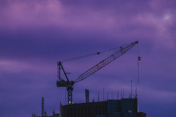 Crane on construction site in evening