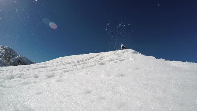 GoPro slow motion - Low angle view of skier jumping over the kicker