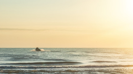 Fishermen on a boat in the open sea