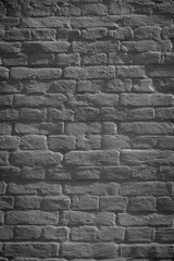 dark grunge weathered brick wall background, full frame view