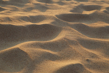 closeup of sand pattern of a beach in the summer
