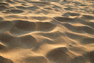 closeup of sand pattern of a beach in the summer