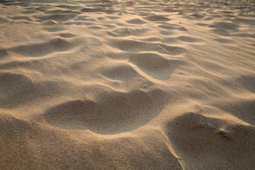 closeup of sand pattern of a beach in the summer