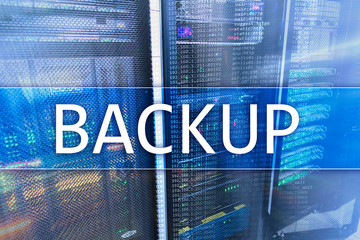 Backup button on modern server room background. Data loss prevention. System recovery.