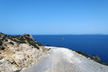 coast of mediterranean sea and a road around the hill