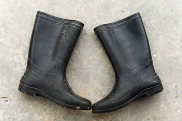 Pair of farmer boots isolated on a grey background 
