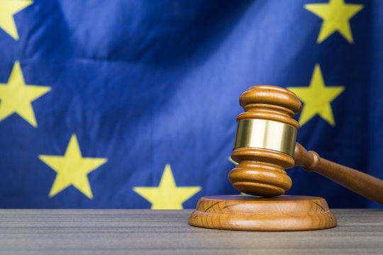 Court gavel with European Union flag in the background