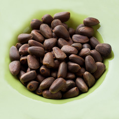 Background of pine nuts. Selective focus. Copy space