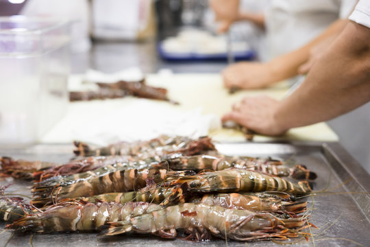 Cleaning tiger shrimps in the restaurant