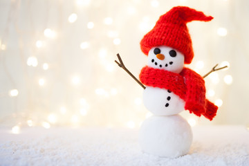 Festive Christmas background with snowman on the snow