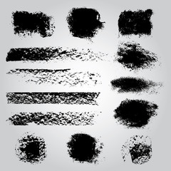 Set of black brush smears. Vector illustration. Grunge texture