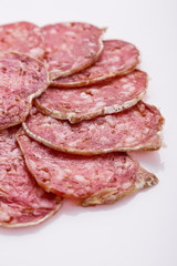 Saucisson sec delicious french salami on a white background