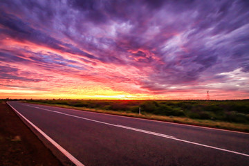 Dramatic sunset sky over outback road