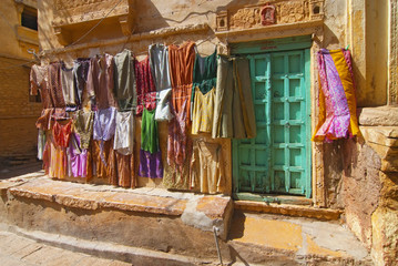 Colourful clothes on a line in the streets of Jaisalmer in India.