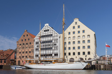 View across the Motlawa River towards buildings comprising the National Maritime Museum on Olowianka Island in Gdansk, Poland. - 224882895
