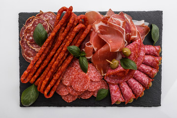 Cold smoked meat plate on a white background