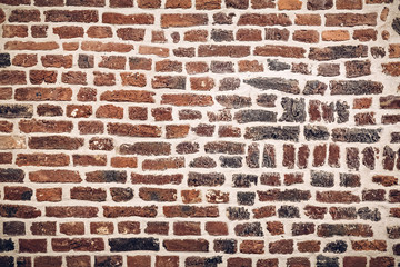 Fototapety  Old brick fortress wall in Germany. Can be used as a background texture