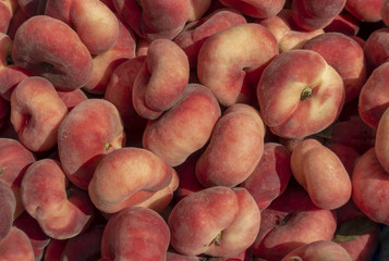Red and Yellow Donut Peaches in a Box