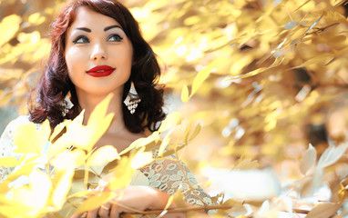 Beautiful girl in a autumn  park