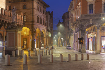 Bologna - The square Piazza della Mercanzia at dusk.