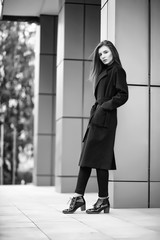 Obraz premium Girl in a coat black and white photo