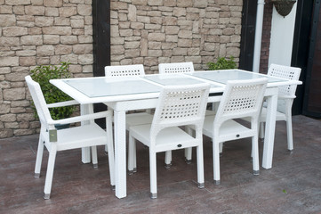 white wicker patio dining set