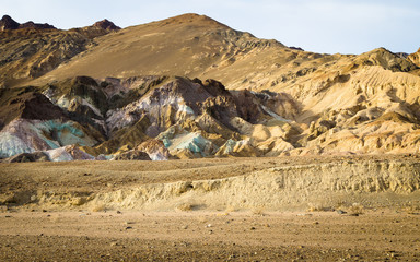 Coloured minerals on eroded hillside at Artist's Pallete, Death Valley, CA, USA