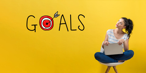 Goals with target with young woman using a laptop computer 