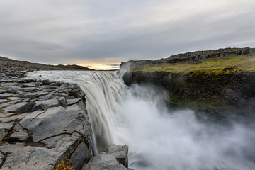 Dettifoss is a waterfall in Vatnajokull National Park in Iceland, and is the most powerful waterfall in Europe. Amazing landscape at sunrise.