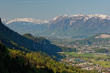 Fototapeta na wymiar Hohenems/Altach, Rhine valley, Austria - sunrise over Rhine valley with snowy peaks of Apenzell Alps in Switzerland