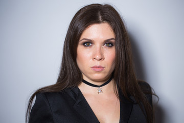 Gorgeous brunette with dark makeup. Halloween witch portrait